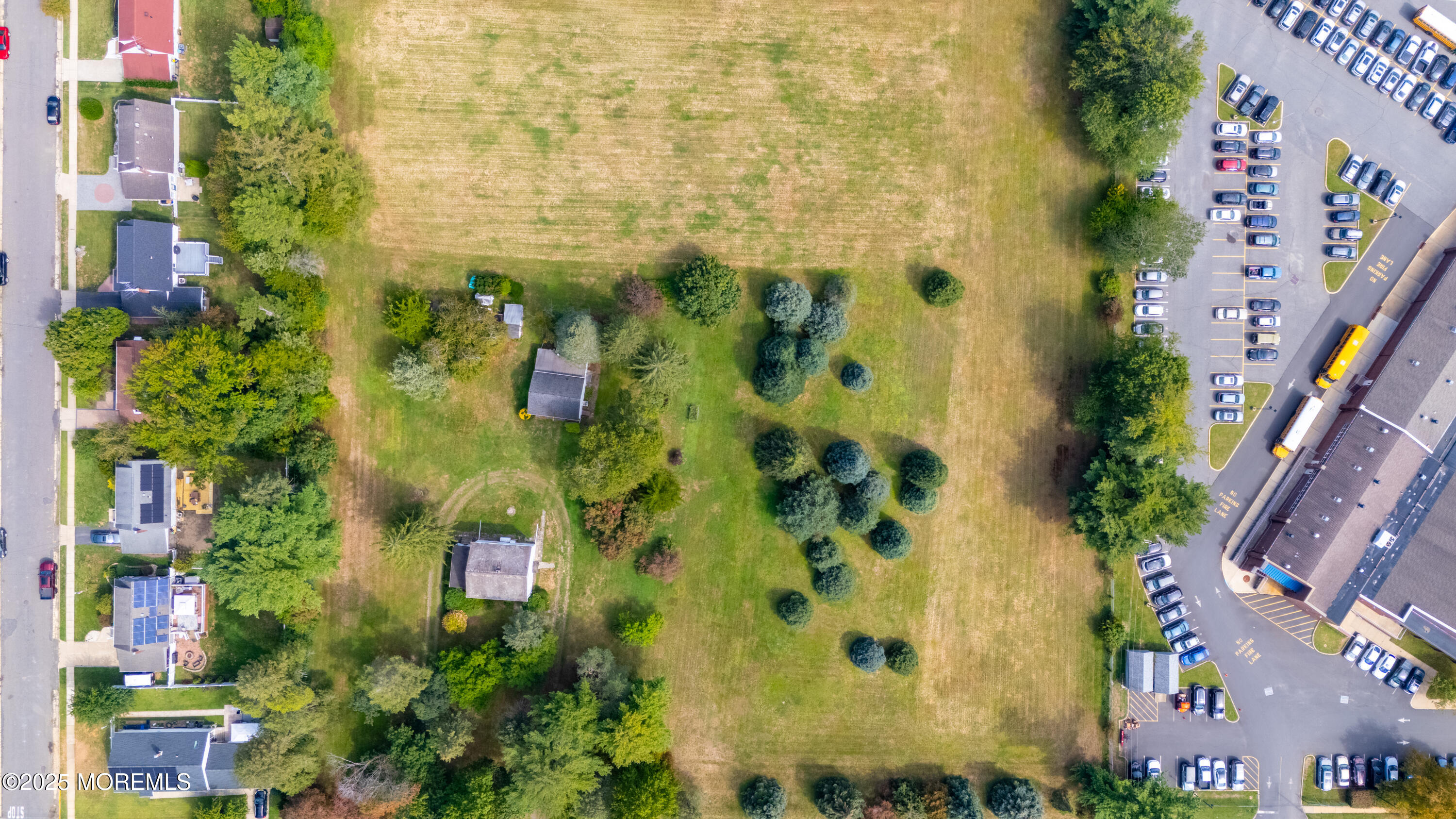 16 Robertsville Road Freehold, NJ 07728 - Photo 32 of 59 an aerial view of a residential apartment building with swimming pool and garden space