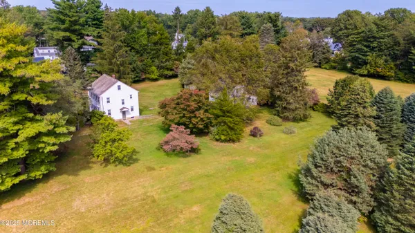 a view of outdoor space with swimming pool and green space