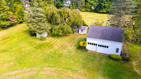 a view of yard with swimming pool and outdoor seating