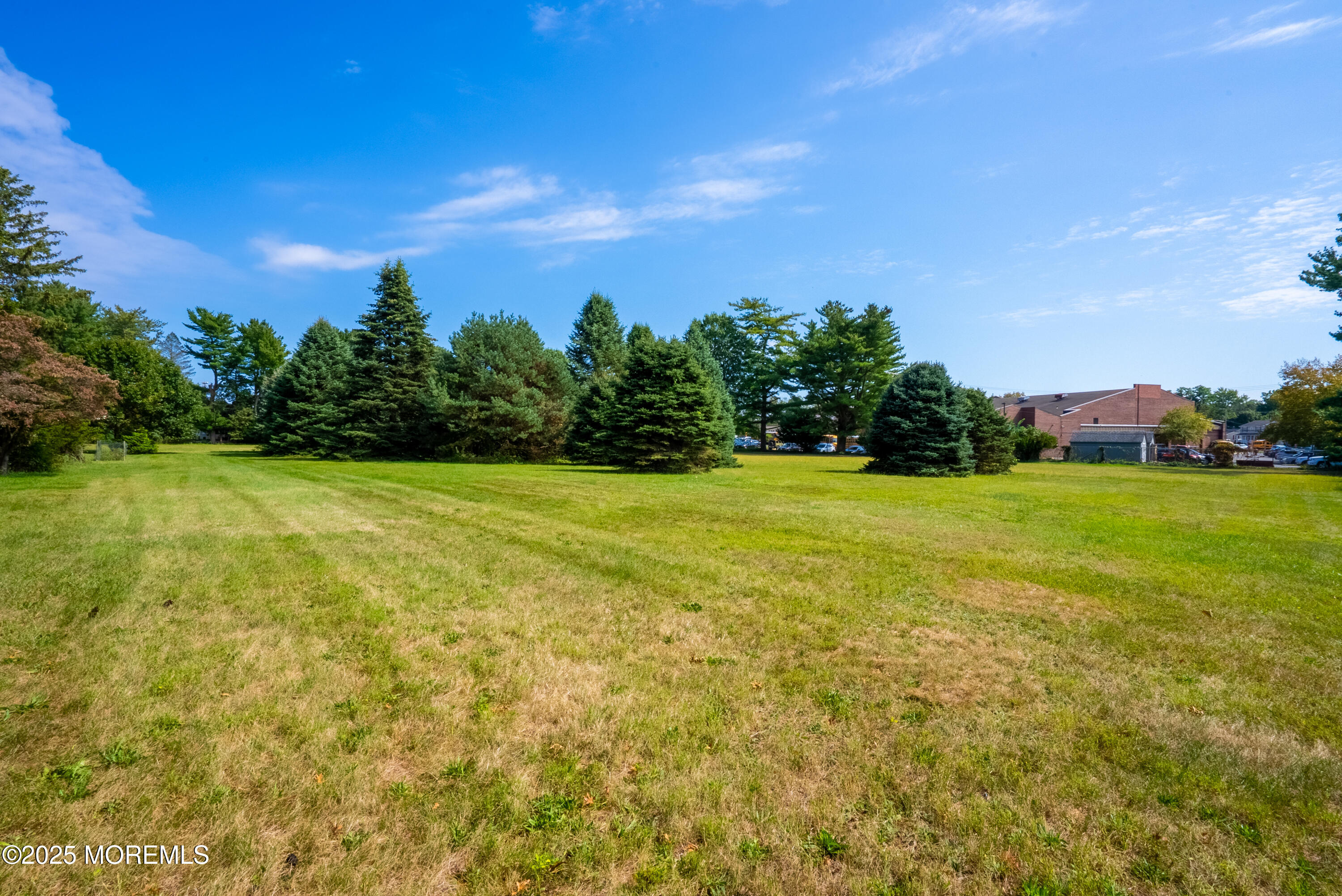 16 Robertsville Road Freehold, NJ 07728 - Photo 50 of 59 a view of a big yard with a house in the background