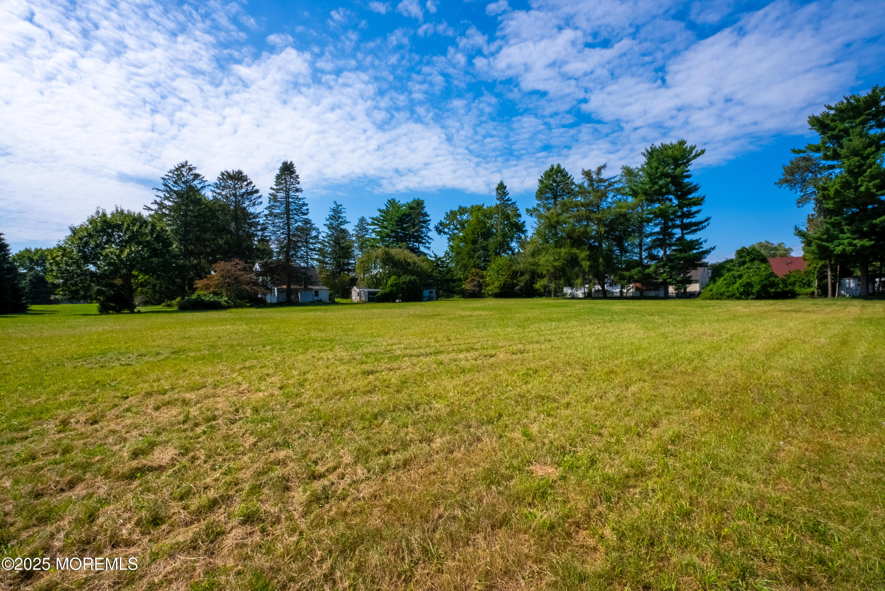 16 Robertsville Road Freehold, NJ 07728 - Photo 54 of 59 a view of a city with tall trees