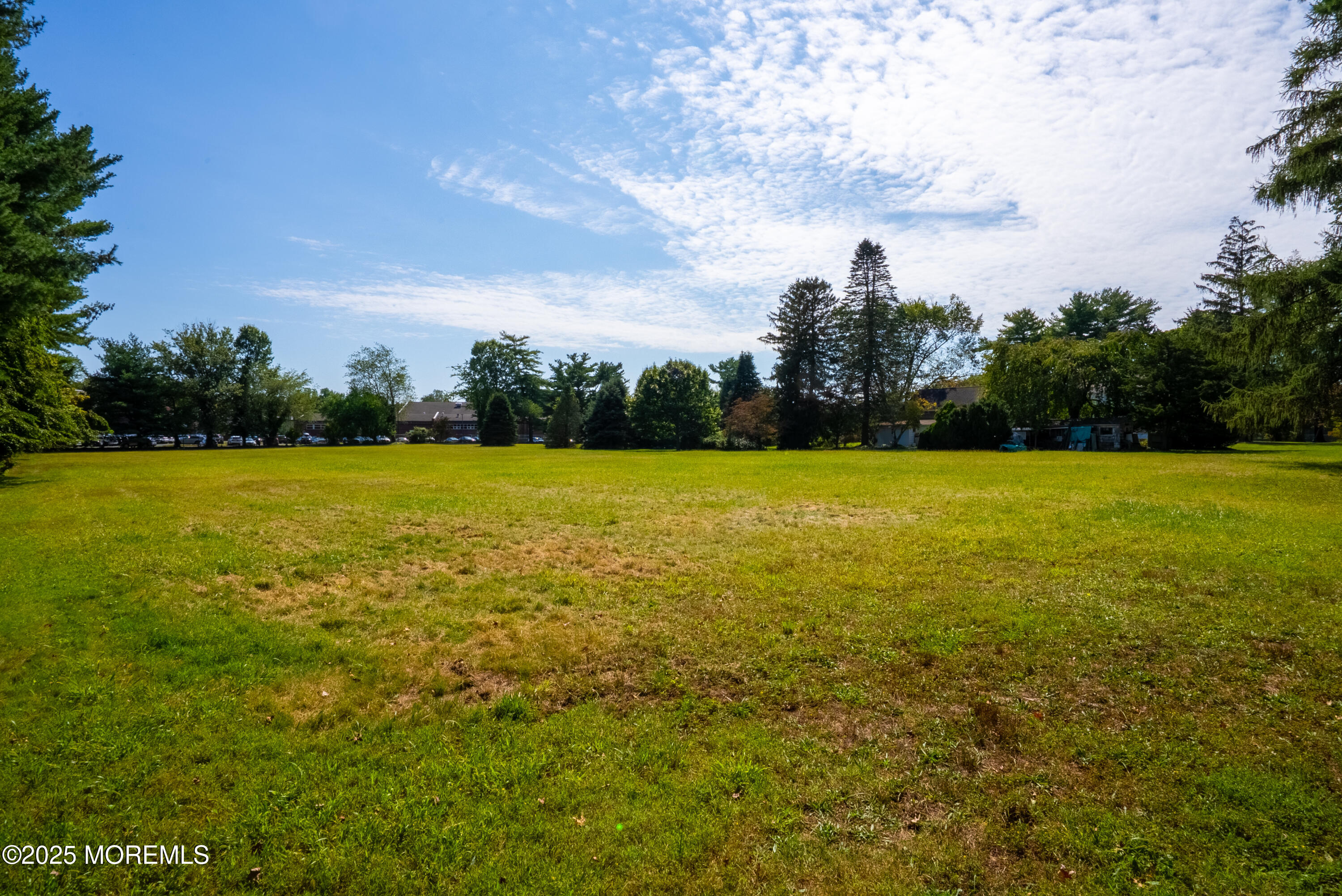 16 Robertsville Road Freehold, NJ 07728 - Photo 55 of 59 a view of a green yard and a fountain