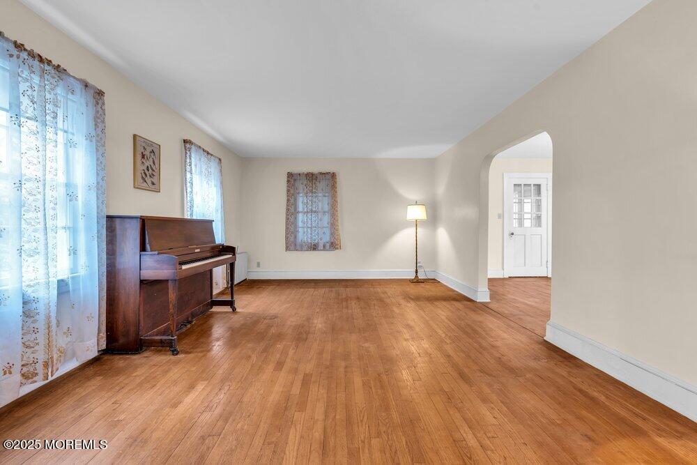 16 Robertsville Road Freehold, NJ 07728 - Photo 9 of 59 a view of empty room with kitchen and window