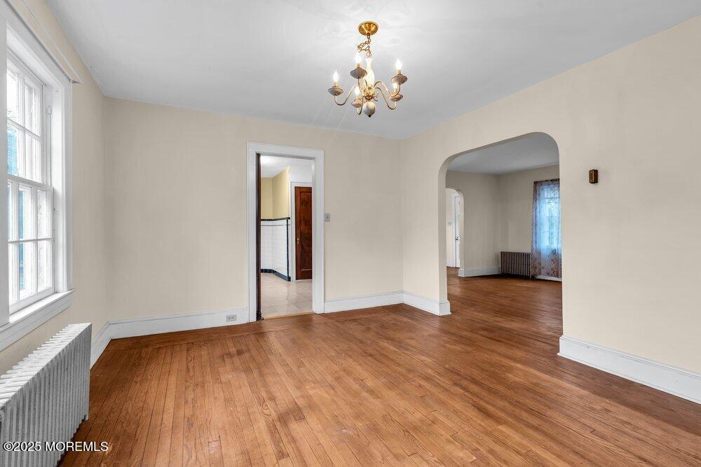 16 Robertsville Road Freehold, NJ 07728 - Photo 10 of 59 wooden floor in an empty room with a window