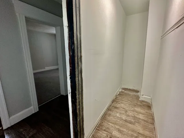 a view of hallway with closet