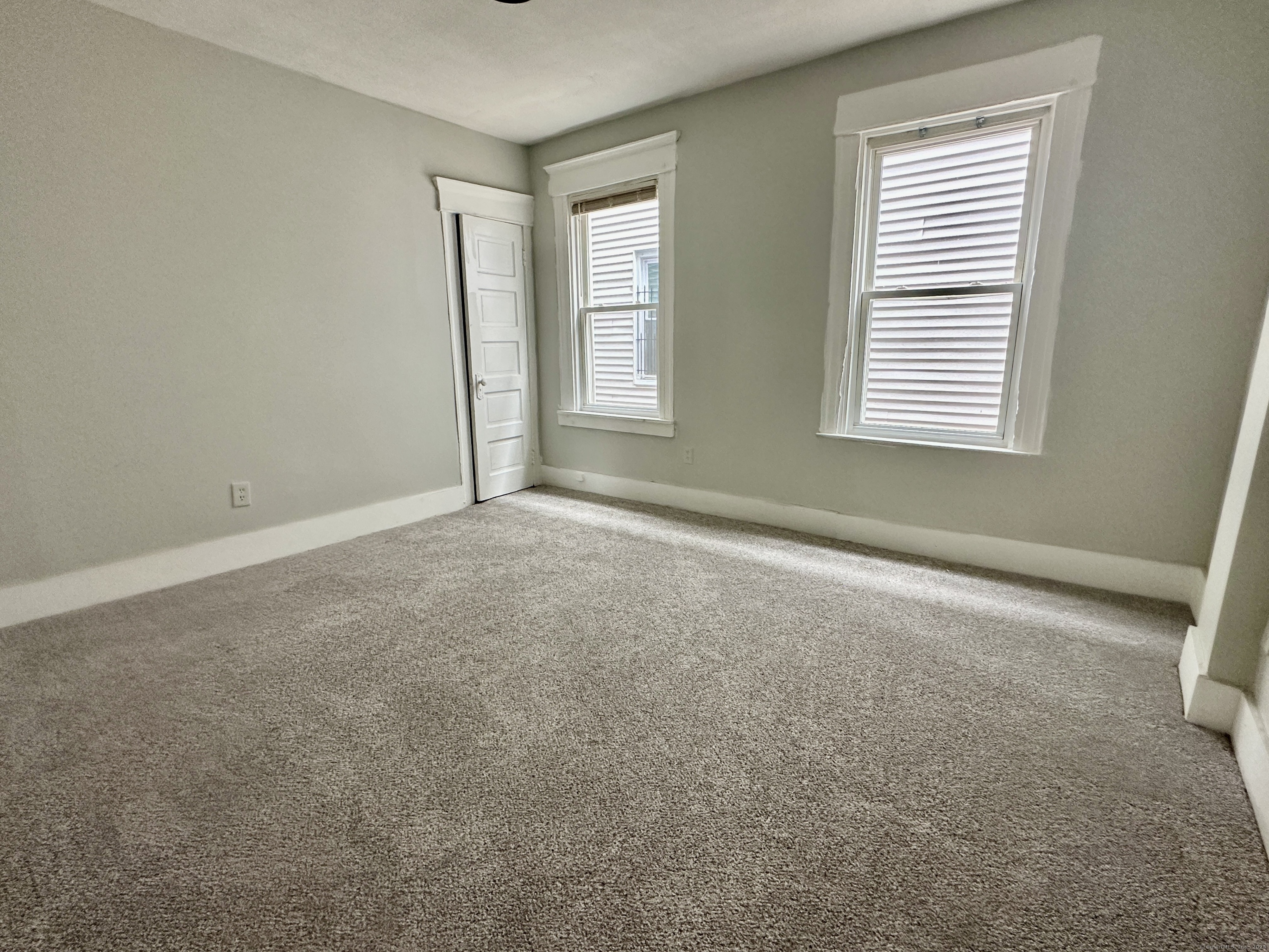 585 Winchester Avenue, Unit 1 New Haven, CT 06511 - Photo 4 of 12 an empty room with windows