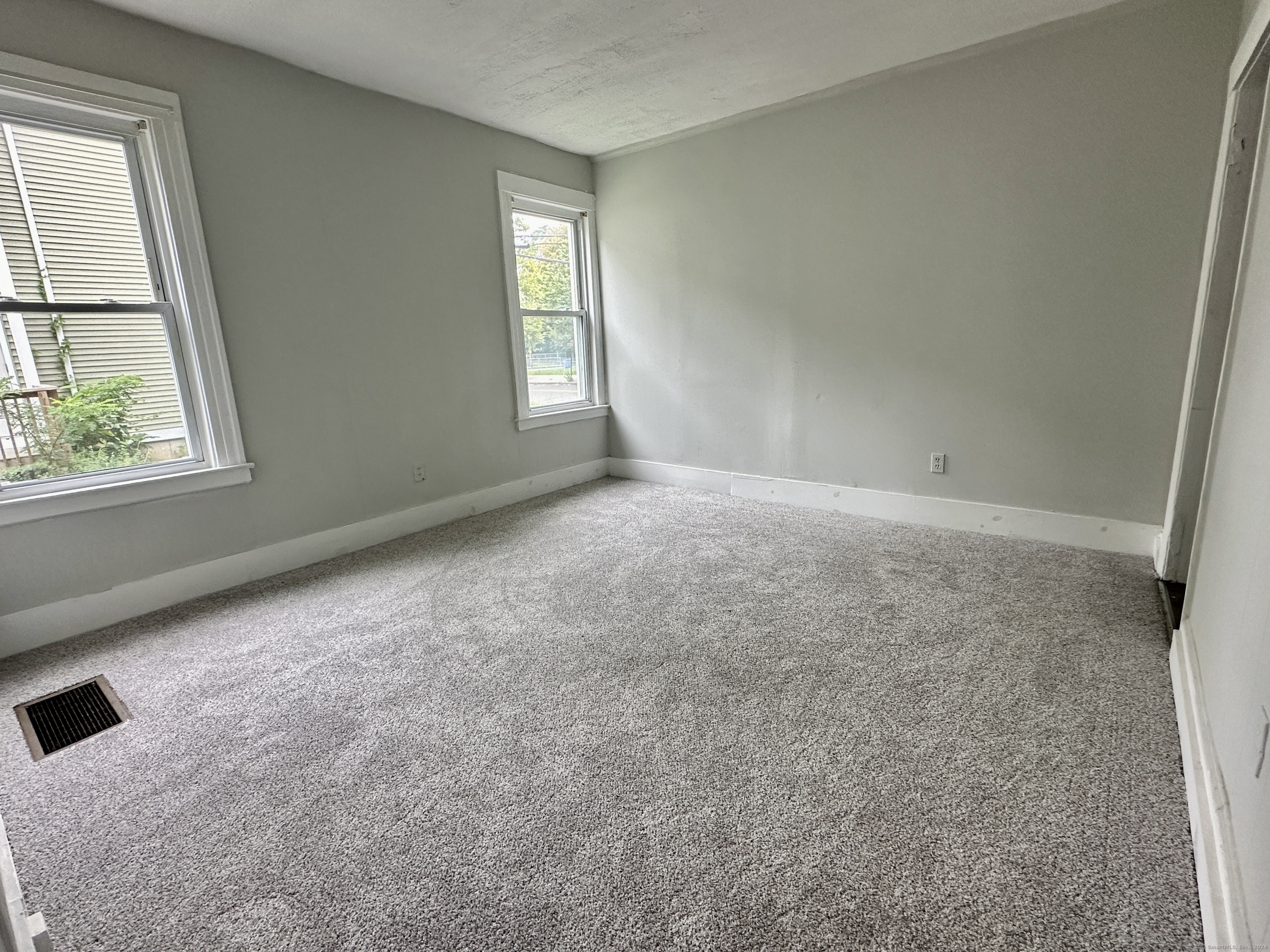 585 Winchester Avenue, Unit 1 New Haven, CT 06511 - Photo 5 of 12 an empty room with windows