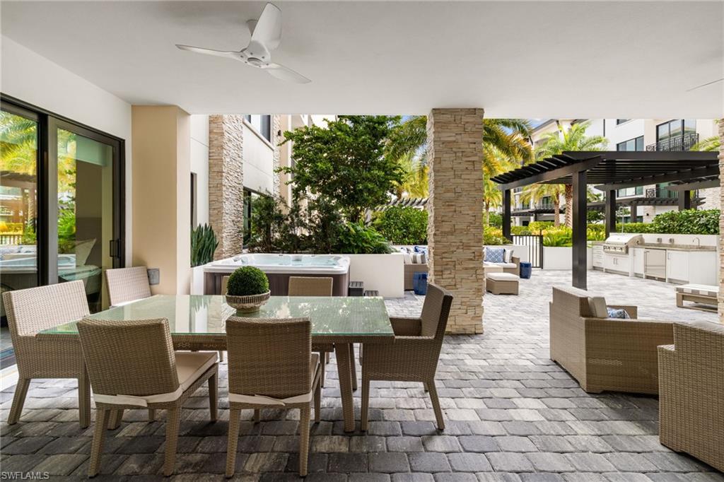1130 3rd Avenue South, Unit 208 Naples, FL 34102 - Photo 19 of 48 a view of a dining room with furniture window and outside view