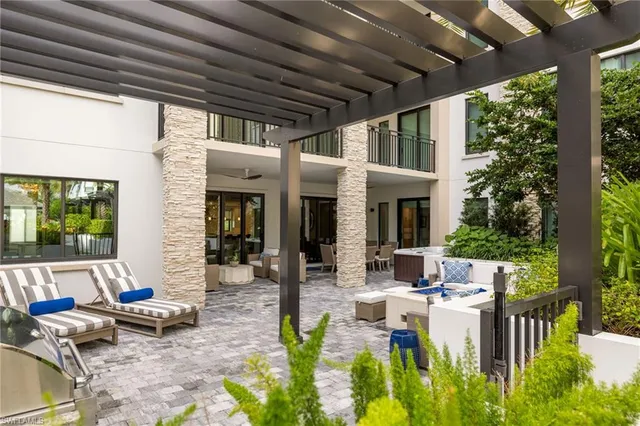 a view of a patio with chairs and tables