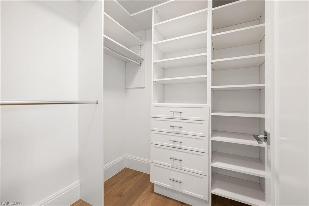 1130 3rd Avenue South, Unit 208 Naples, FL 34102 - Photo 32 of 48 a view of walk in closet with empty racks