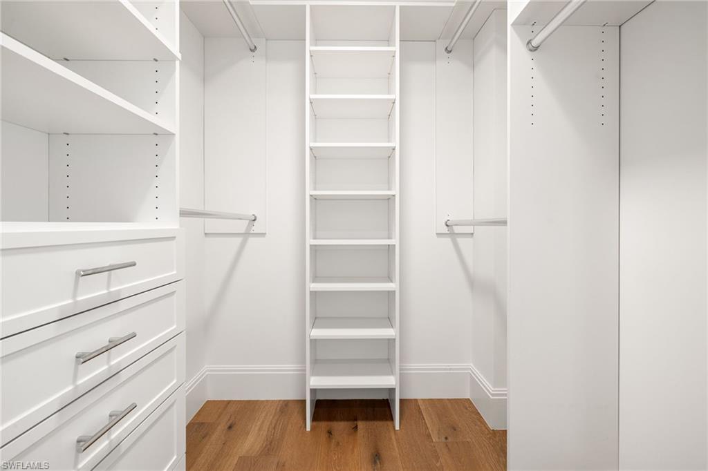 1130 3rd Avenue South, Unit 208 Naples, FL 34102 - Photo 35 of 48 a view of walk in closet with empty racks