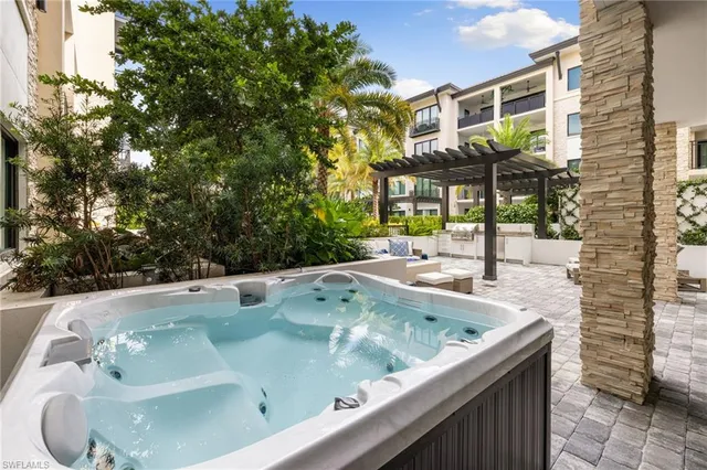 a view of a jacuzzi with a tub and fire pit