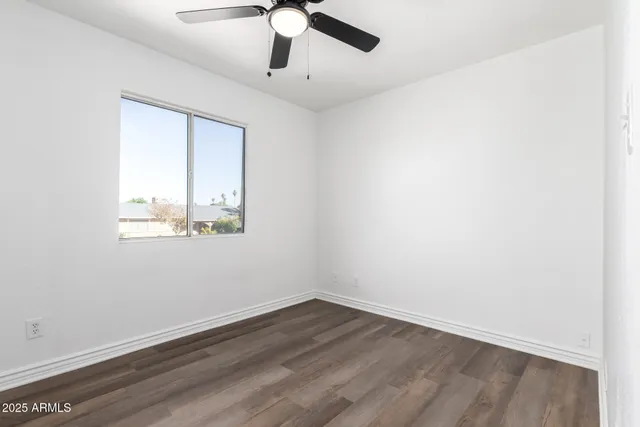 a view of a workspace with furniture and a potted plant