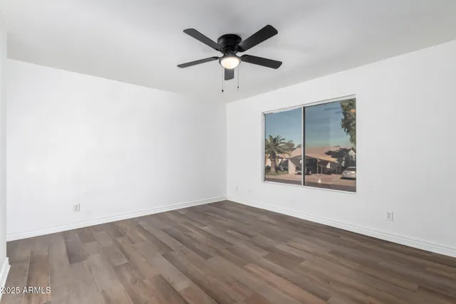 a view of room with window and hardwood floor