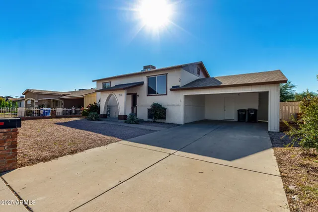 a kitchen with a white cabinets a sink a window and stainless steel appliances