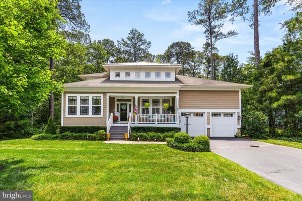 a view of a house with garden and yard