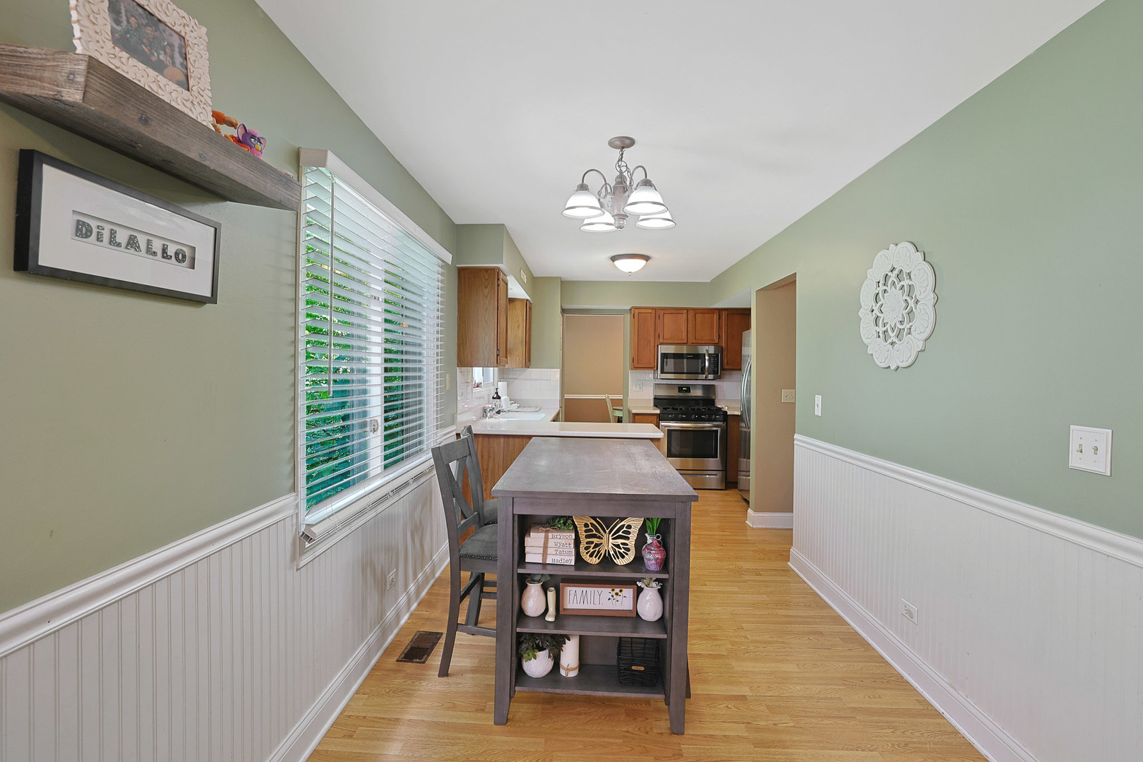 710 Cimarron Drive Cary, IL 60013 - Photo 14 of 31 a view of a dining room with furniture and a chandelier