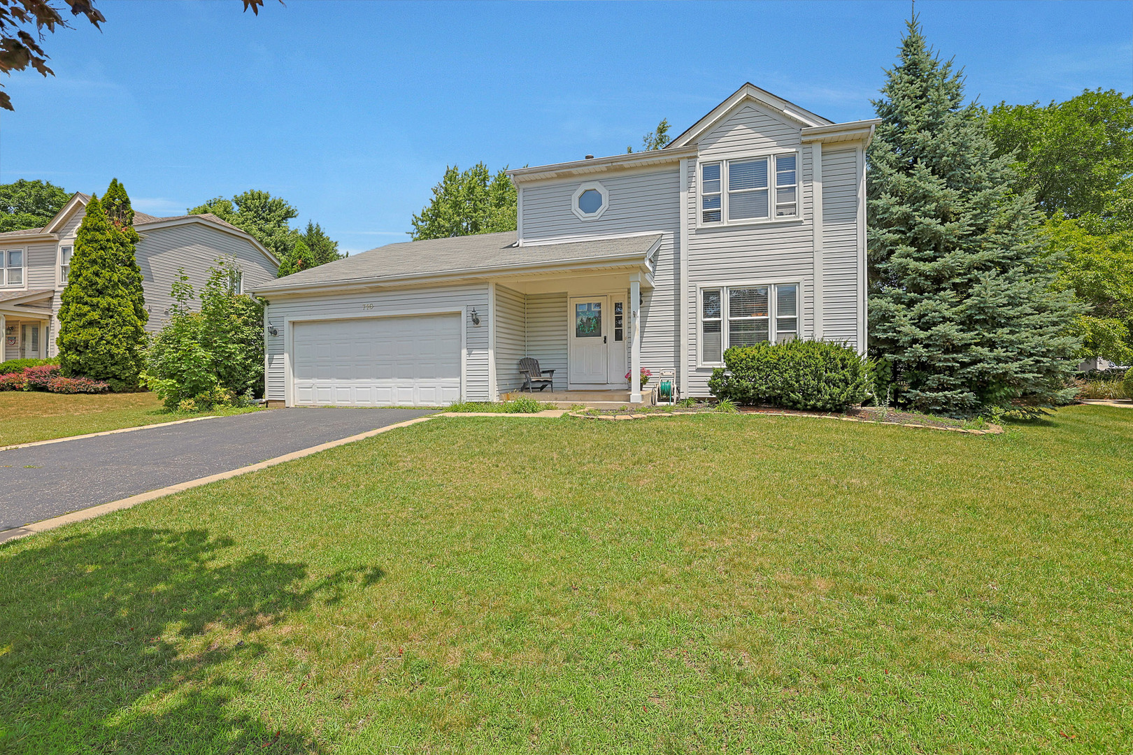 710 Cimarron Drive Cary, IL 60013 - Photo 2 of 31 a front view of a house with a yard