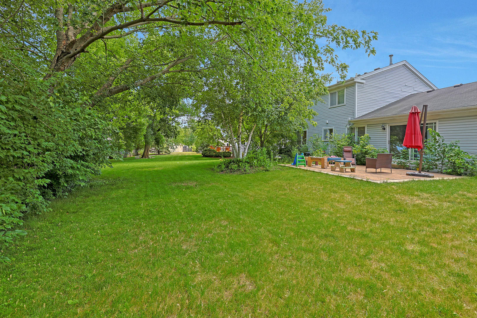 710 Cimarron Drive Cary, IL 60013 - Photo 22 of 31 a front view of house with yard and green space