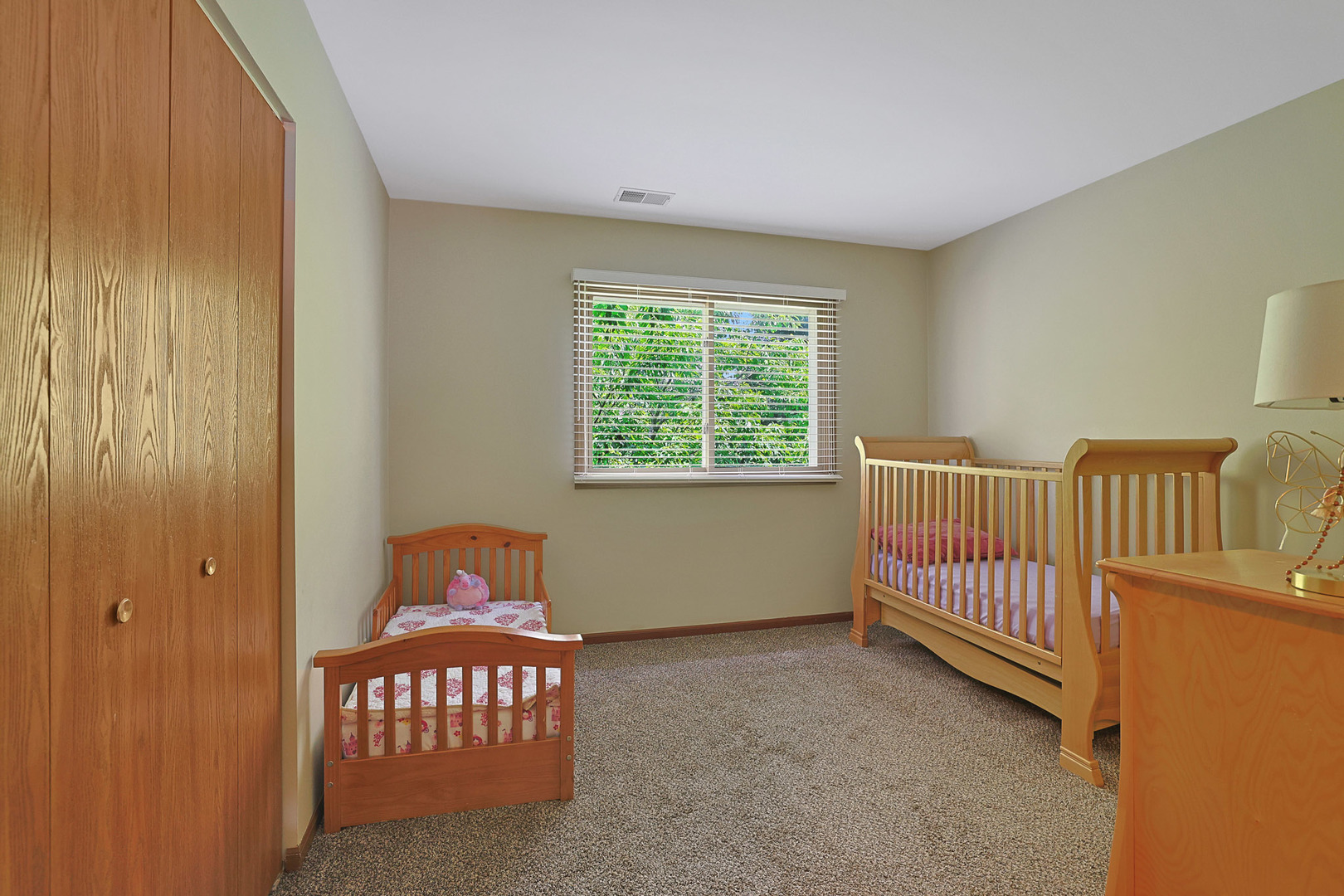 710 Cimarron Drive Cary, IL 60013 - Photo 6 of 31 a bedroom with a bed and a window
