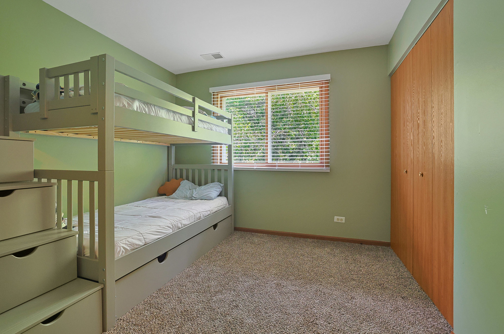 710 Cimarron Drive Cary, IL 60013 - Photo 7 of 31 a bedroom with a bed and a window