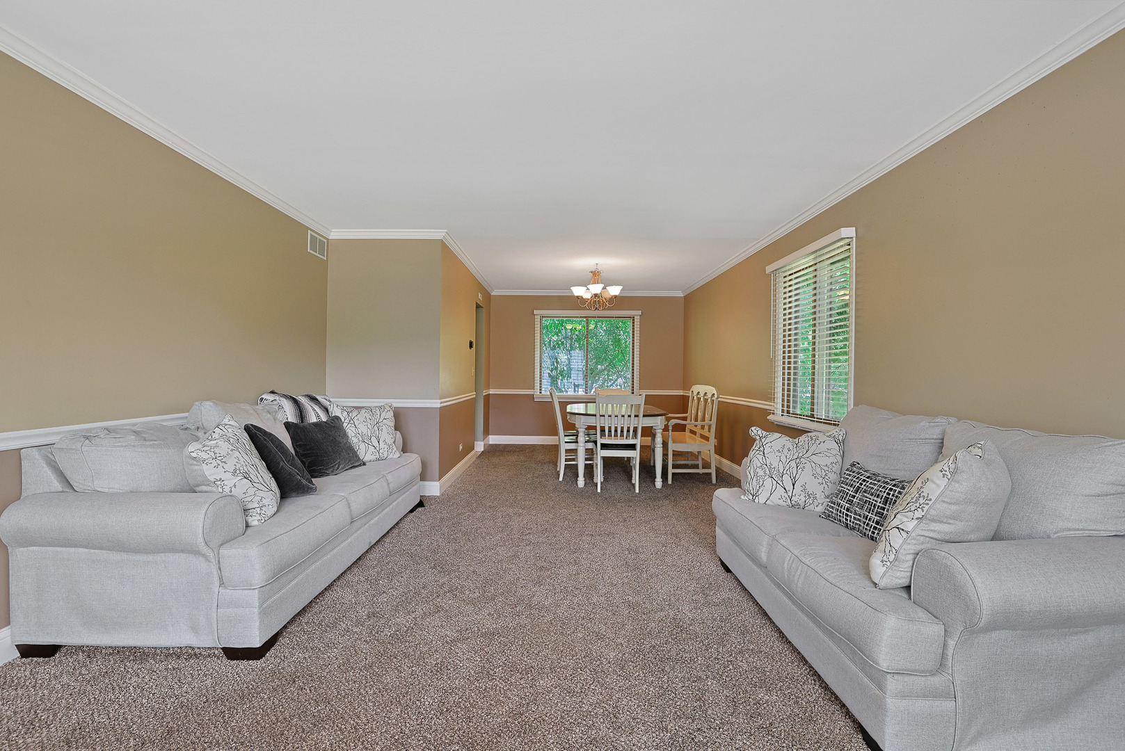 710 Cimarron Drive Cary, IL 60013 - Photo 9 of 31 a living room with furniture and a couch