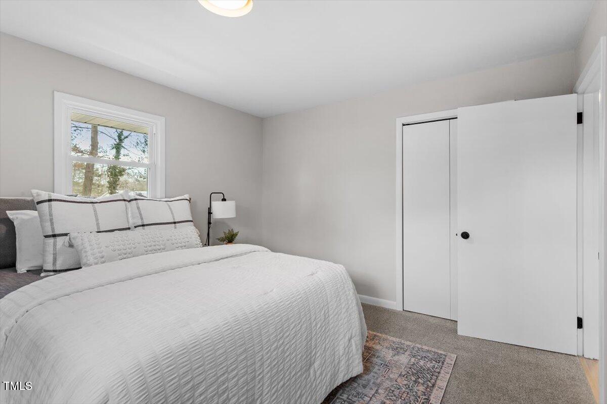 3408 Brentwood Road Raleigh, NC 27604 - Photo 18 of 41 a bedroom with a bed and a window
