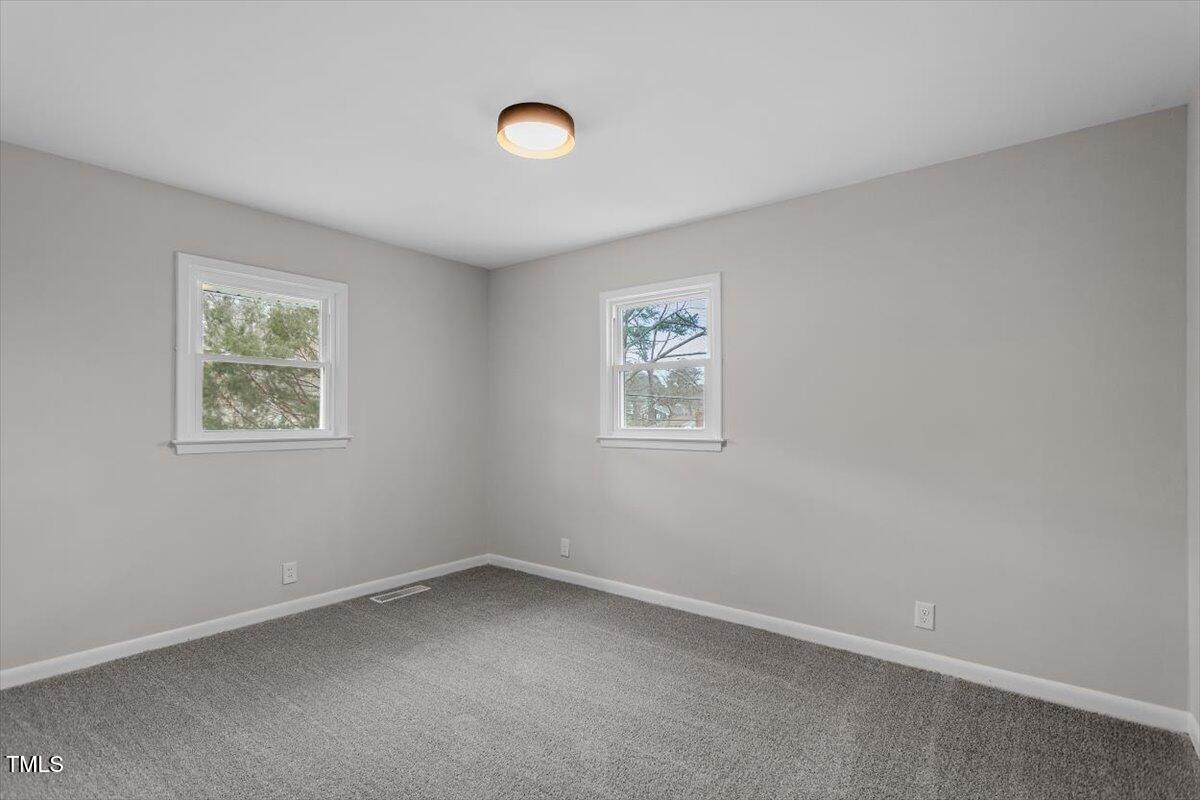 3408 Brentwood Road Raleigh, NC 27604 - Photo 21 of 41 an empty room with a window