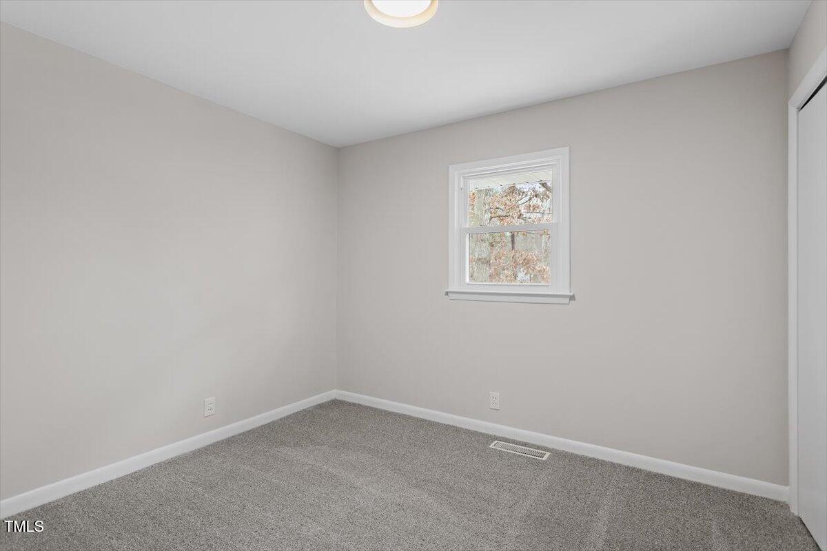 3408 Brentwood Road Raleigh, NC 27604 - Photo 22 of 41 an empty room with a window
