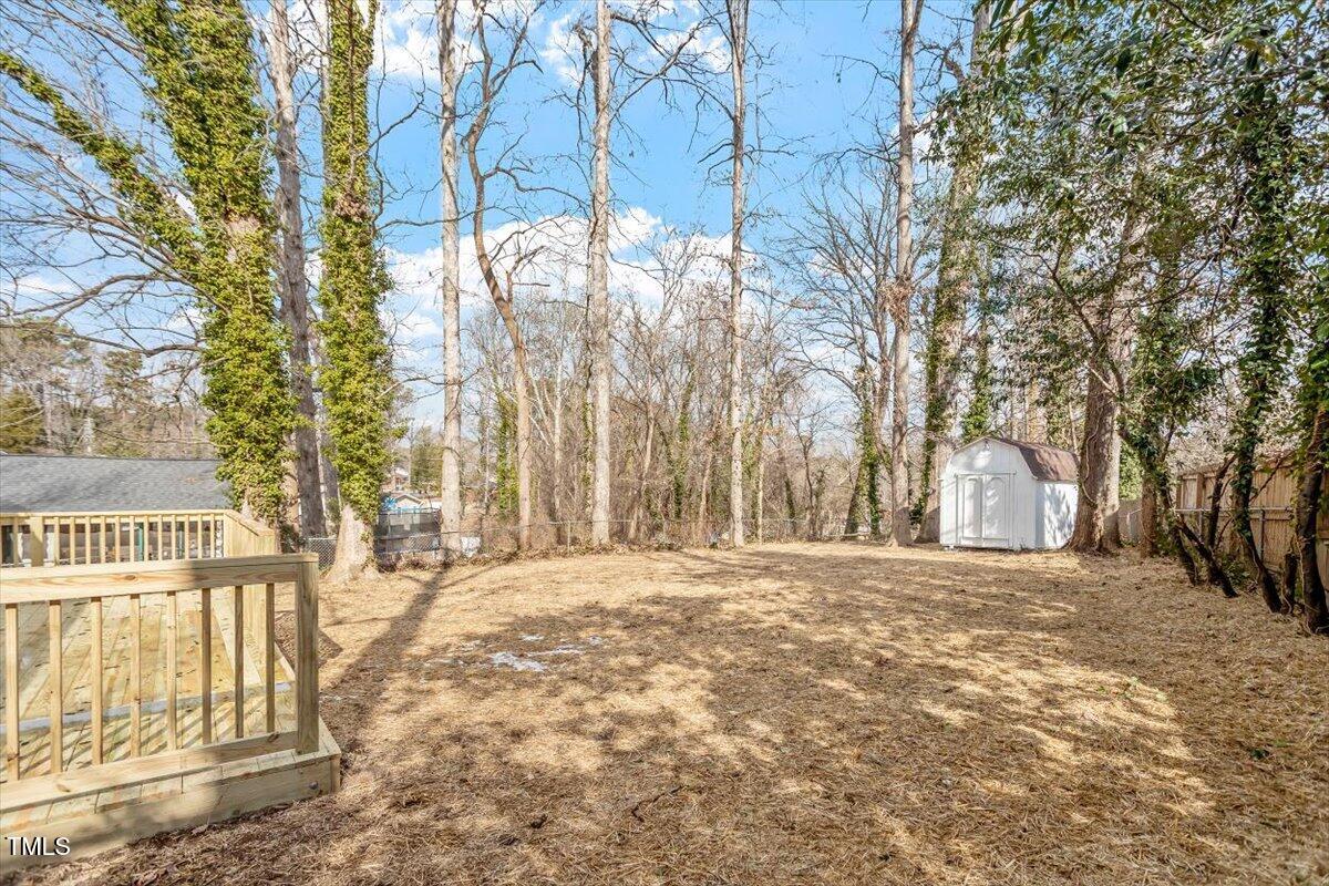 3408 Brentwood Road Raleigh, NC 27604 - Photo 33 of 41 a view of a yard with trees