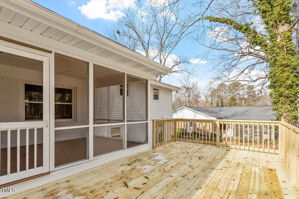 3408 Brentwood Road Raleigh, NC 27604 - Photo 34 of 41 a view of a house with a wooden deck