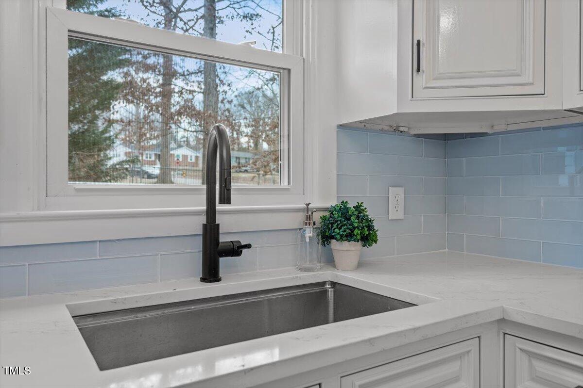 3408 Brentwood Road Raleigh, NC 27604 - Photo 9 of 41 a kitchen with a sink and bathtub