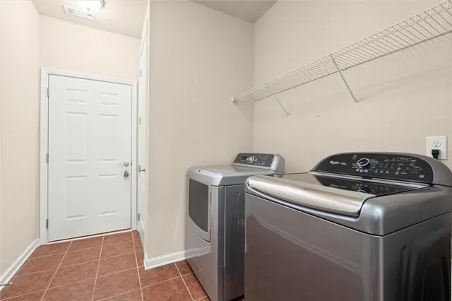 a view of storage and utility room with washer and dryer