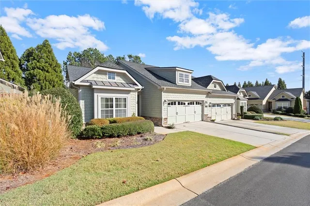 a front view of a house with a yard