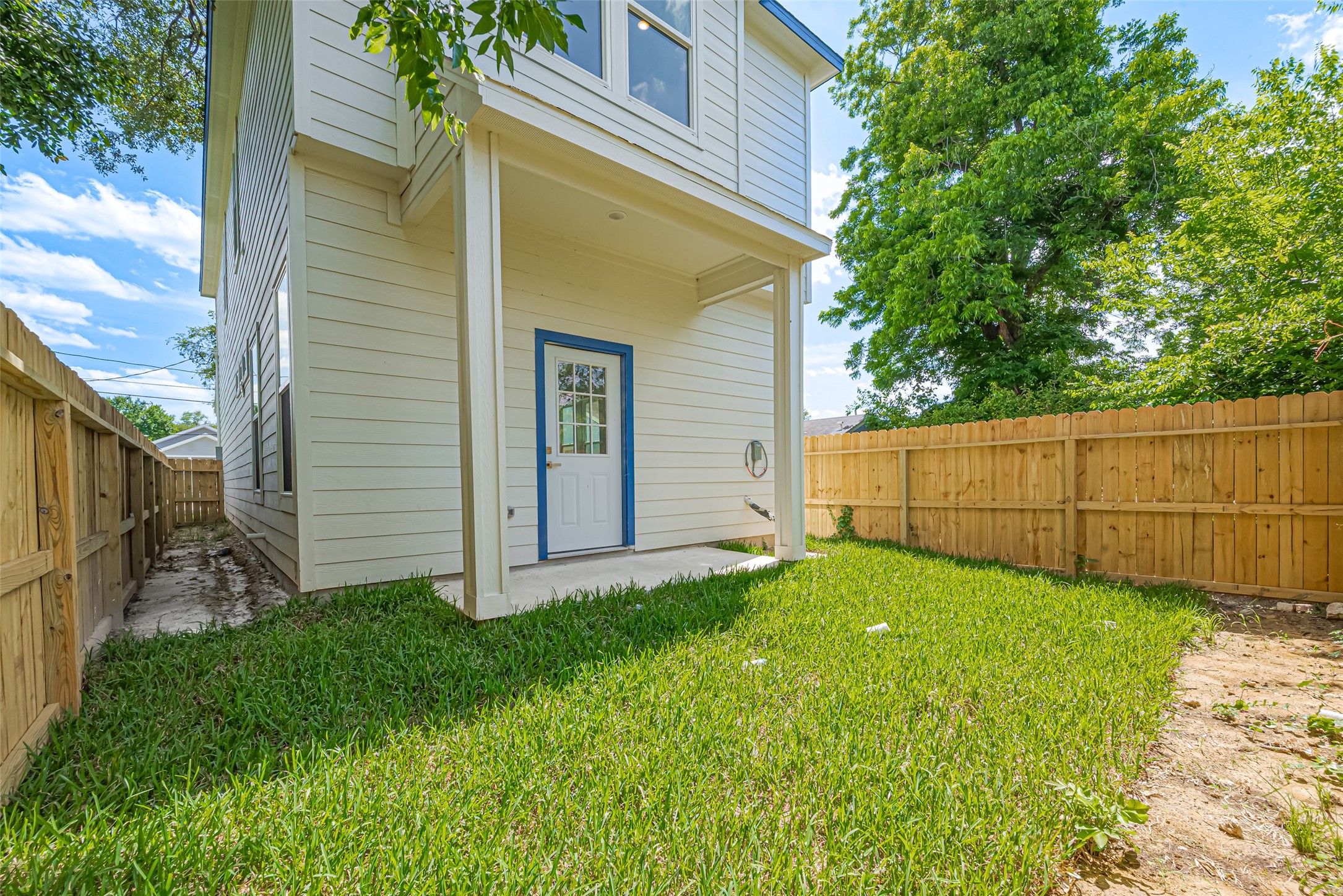 7207 Force Street Houston, TX 77020 - Photo 26 of 29 The back door is framed by a small covered patio.