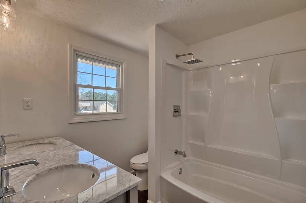 411 Redds Branch Road Aiken, SC 29801 - Photo 15 of 25 a bathroom with a sink and a bathtub
