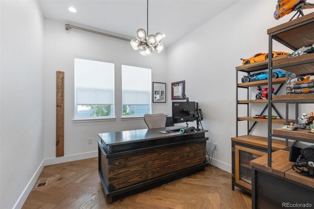 a reading room with furniture and a window