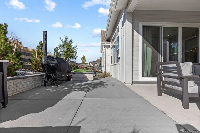 a view of living room with furniture and a grill