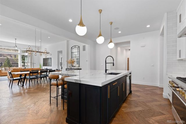 a large kitchen with lots of counter space and a sink