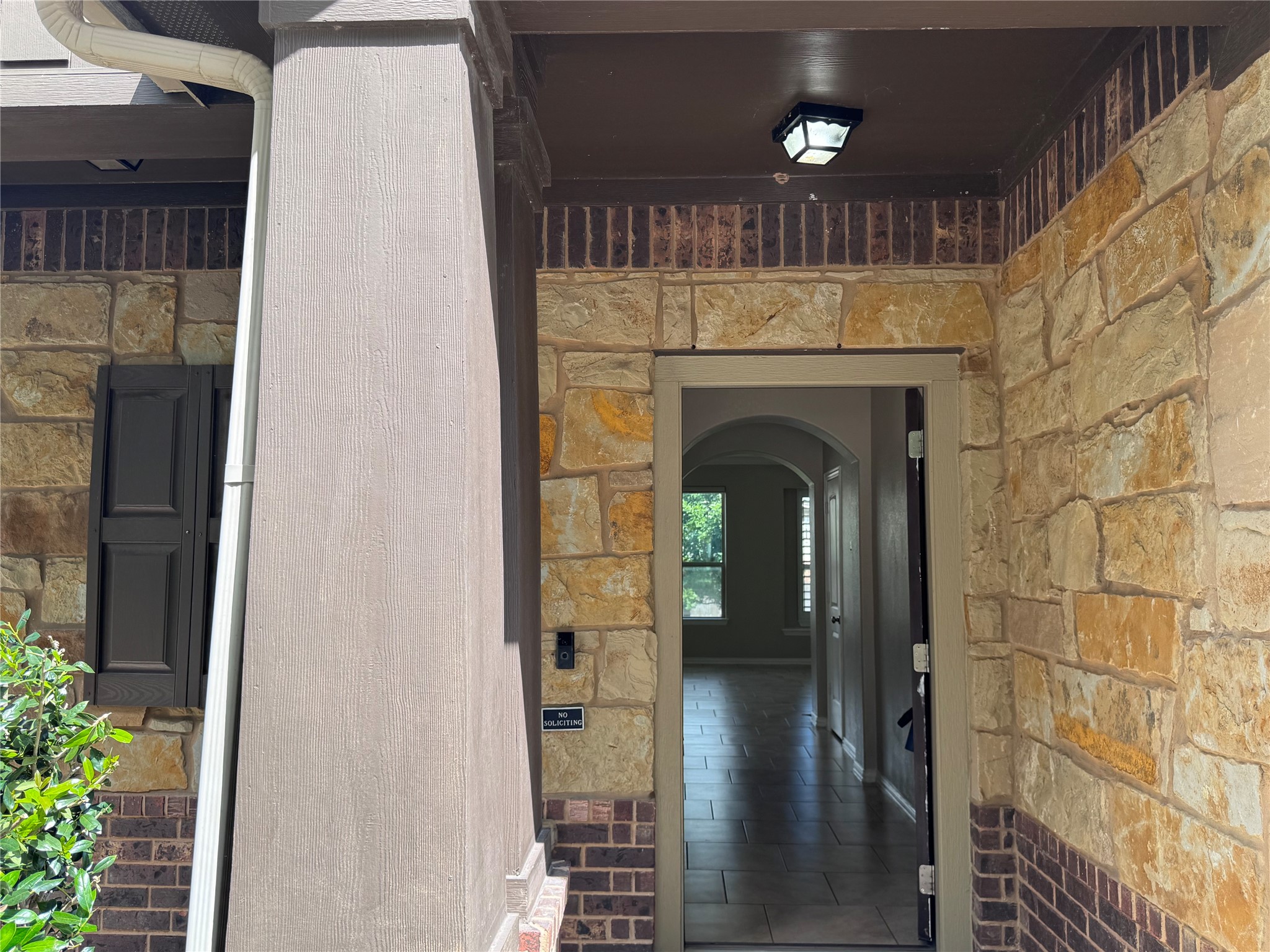 2605 Rough Berry Road Pflugerville, TX 78660 - Photo 4 of 40 A welcoming stone facade with a sheltered entry invites you into a well-appointed interior.
