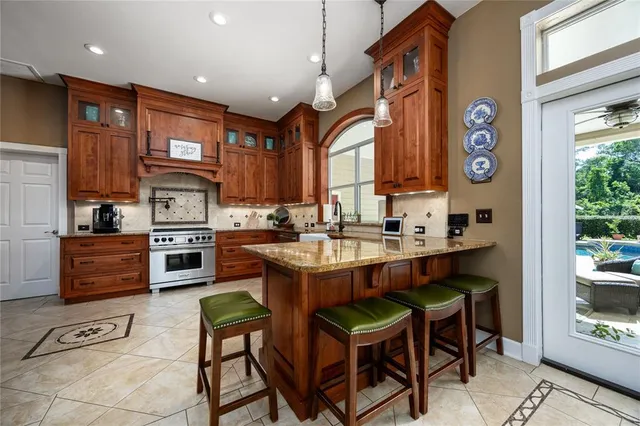 a view of a backyard with potted plants and palm trees