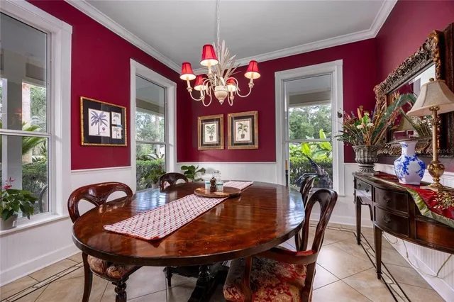 a view of a house with swimming pool and sitting area
