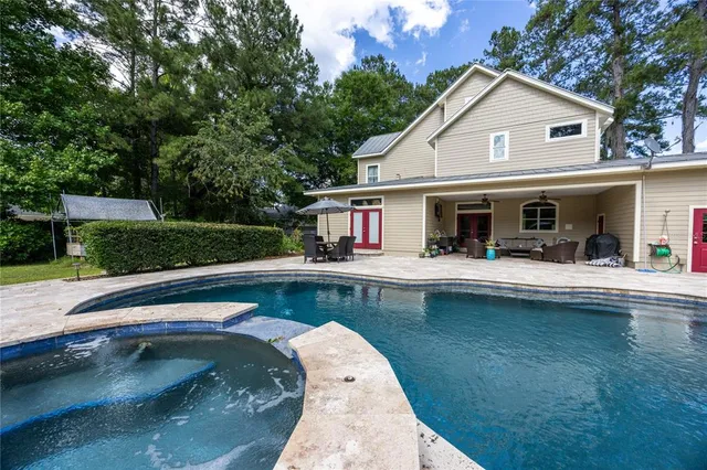 an outdoor space with furniture and outdoor view