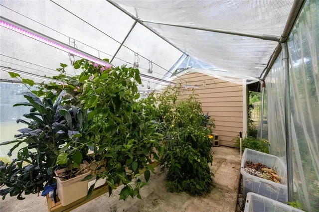 an aerial view of a house with swimming pool and outdoor space
