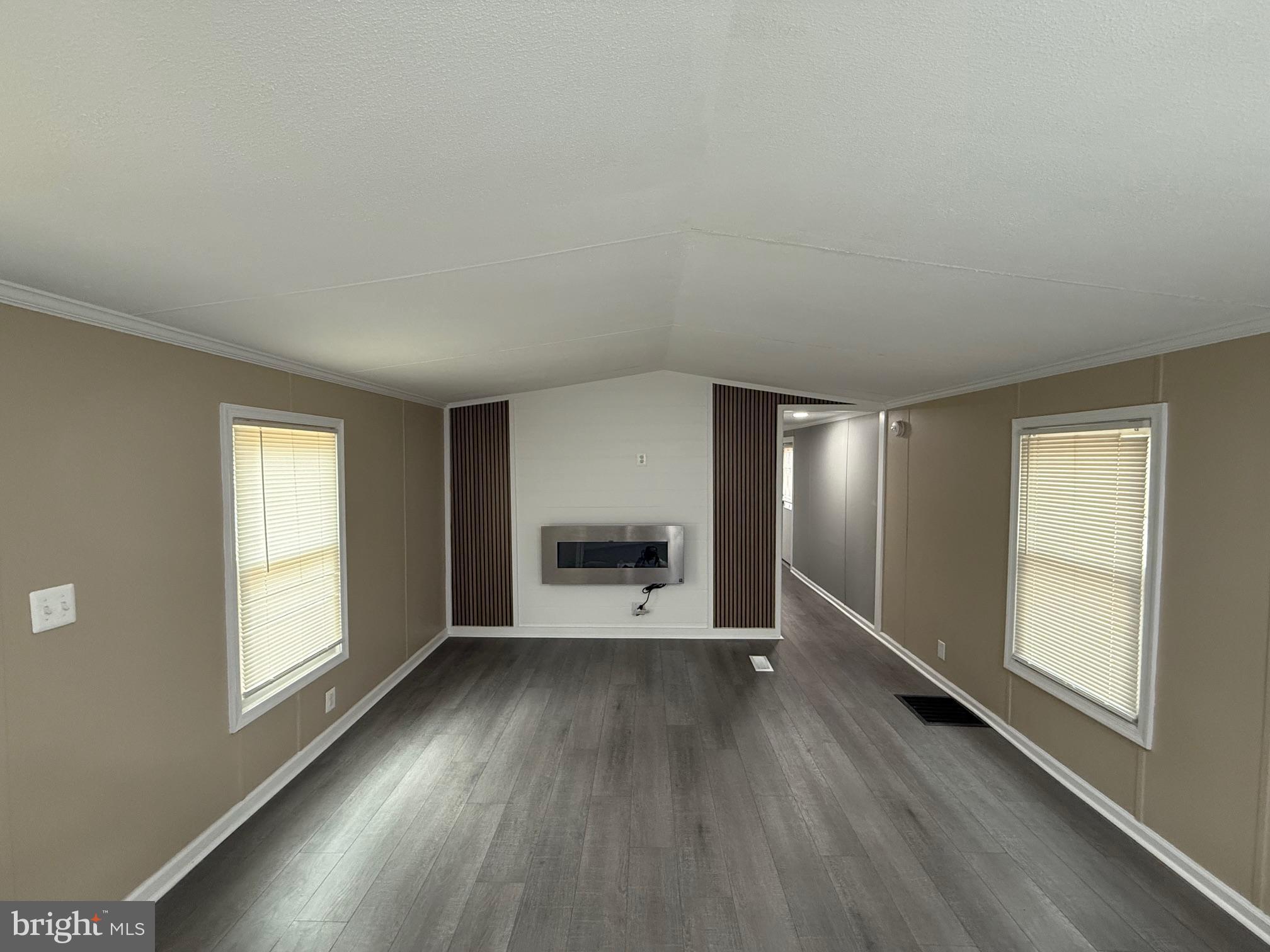 21182 Marsh Creek Road Preston, MD 21655 - Photo 4 of 9 wooden floor in an empty room with a window