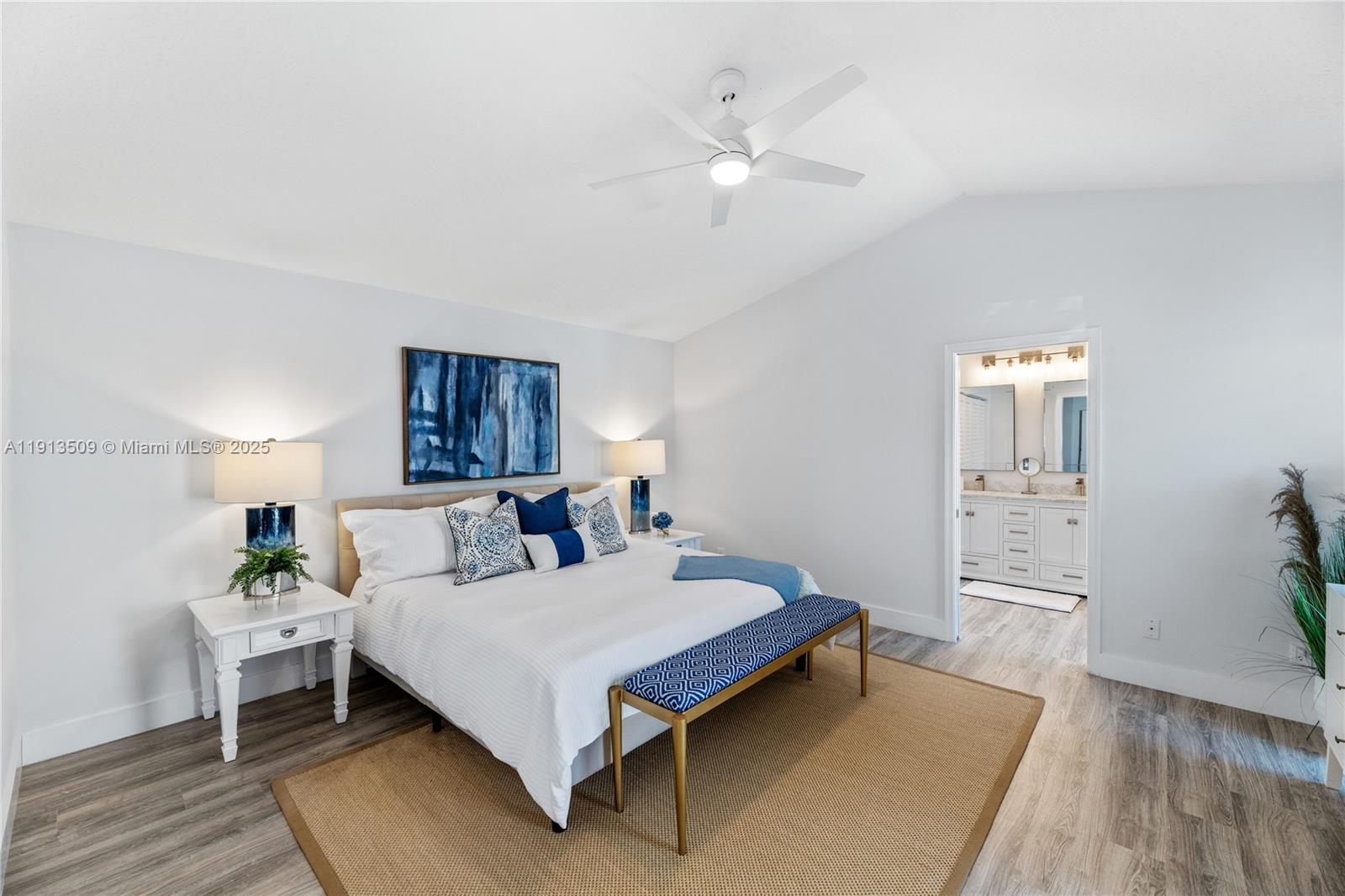 701 Sea Oats Drive, Unit D1 Juno Beach, FL 33408 - Photo 11 of 27 a bed room with a bed and a chandelier