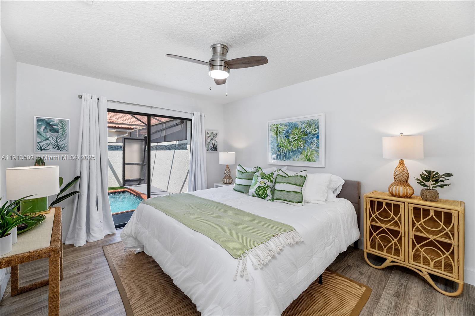 701 Sea Oats Drive, Unit D1 Juno Beach, FL 33408 - Photo 23 of 27 a bedroom with a bed table and a window