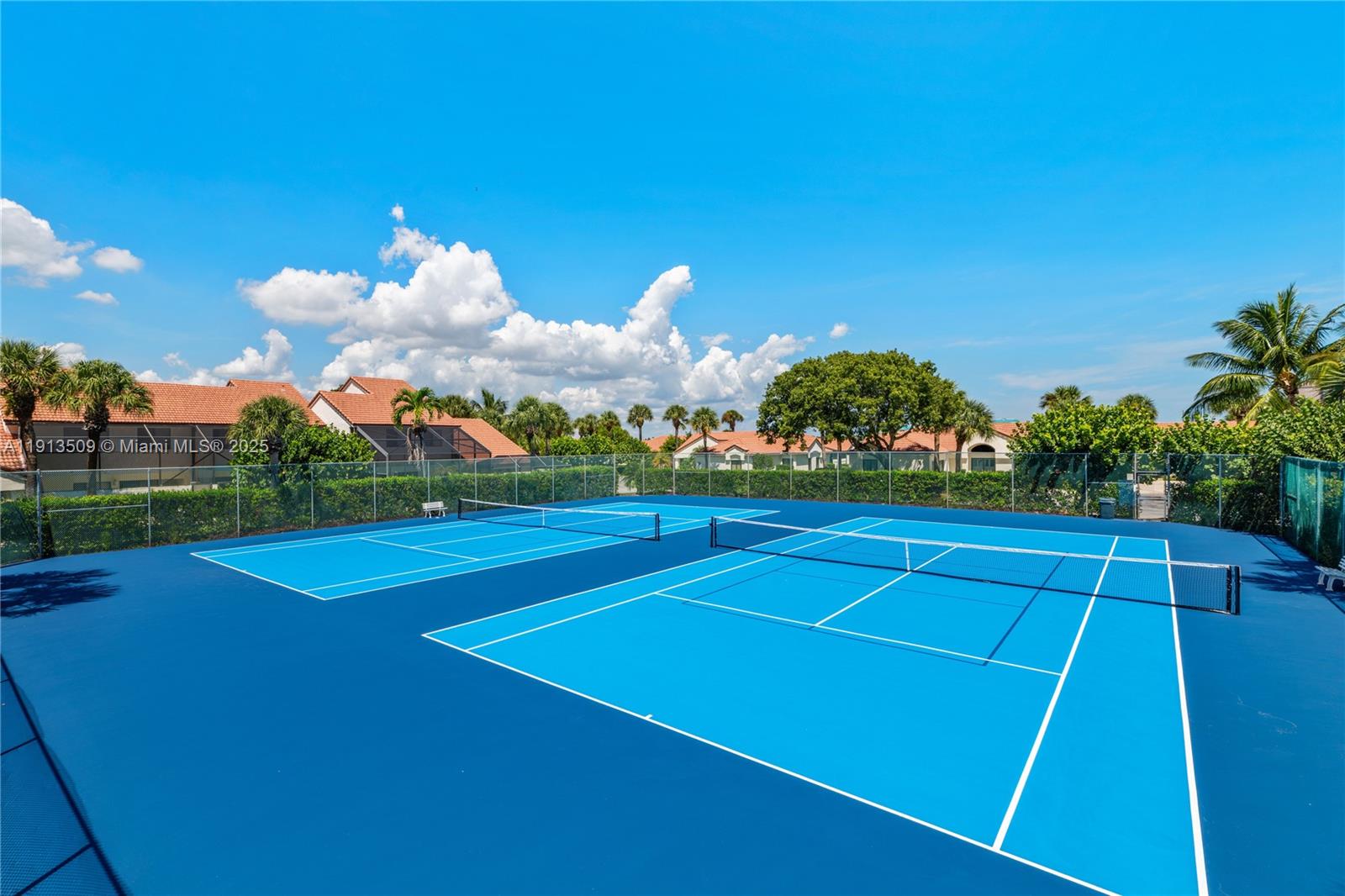 701 Sea Oats Drive, Unit D1 Juno Beach, FL 33408 - Photo 27 of 27 a view of an outdoor space and tennis court