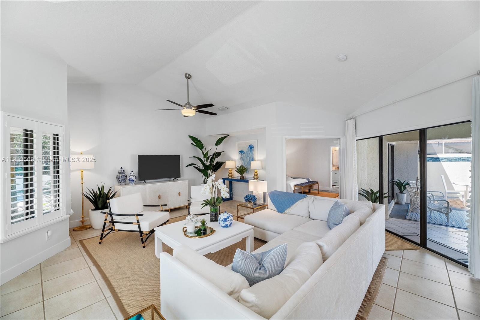 701 Sea Oats Drive, Unit D1 Juno Beach, FL 33408 - Photo 4 of 27 a living room with furniture and a floor to ceiling window