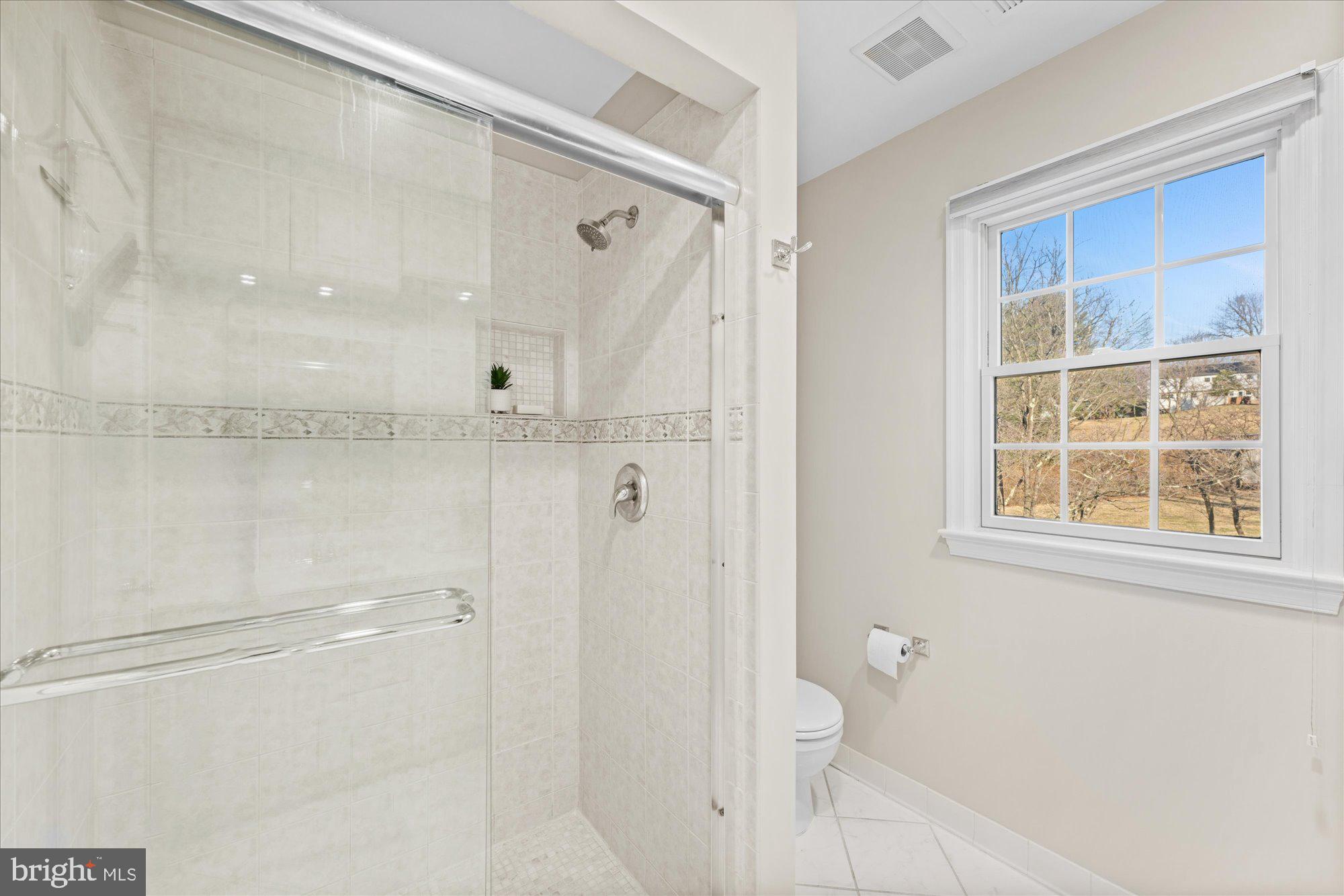 13321 Glen Mill Road Rockville, MD 20850 - Photo 19 of 31 a bathroom with a shower and a toilet